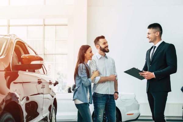 Couple and sales man showroom